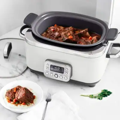 GreenPan Elite 14-in-1 slow cooker in cloud cream with PFAS-free ceramic coating and multi-function cooking settings.