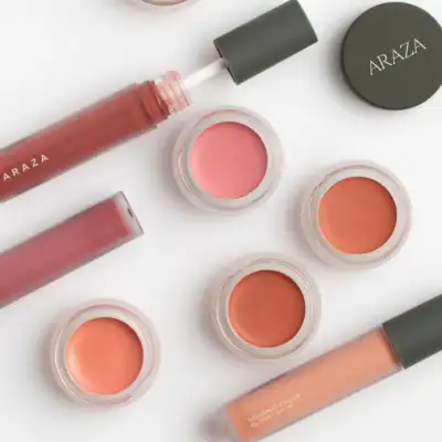 Araza Beauty Coconut Color Glossy Balm providing sheer color and hydration with coconut oil and botanical ingredients.