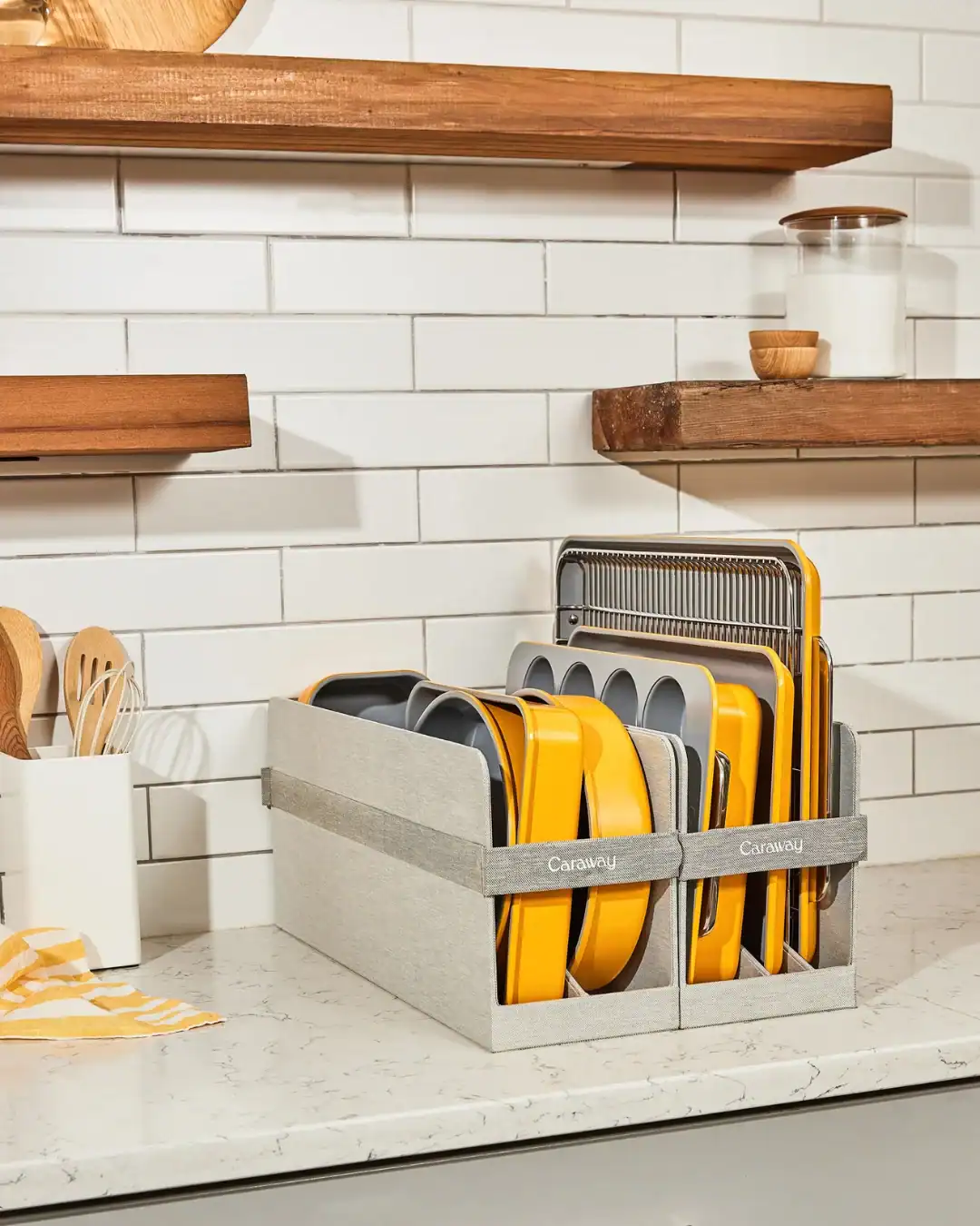 Caraway ceramic-coated bakeware set featuring PFAS-free non-stick baking sheets and muffin pans.
