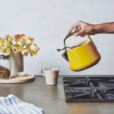 Caraway marigold non-toxic tea kettle with ceramic-coated stainless steel, PFAS-free and lead-free kitchen kettle.