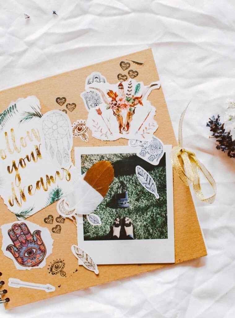 Handmade scrapbook with printed photos, handwritten notes, and washi tape as a sentimental Christmas gift.