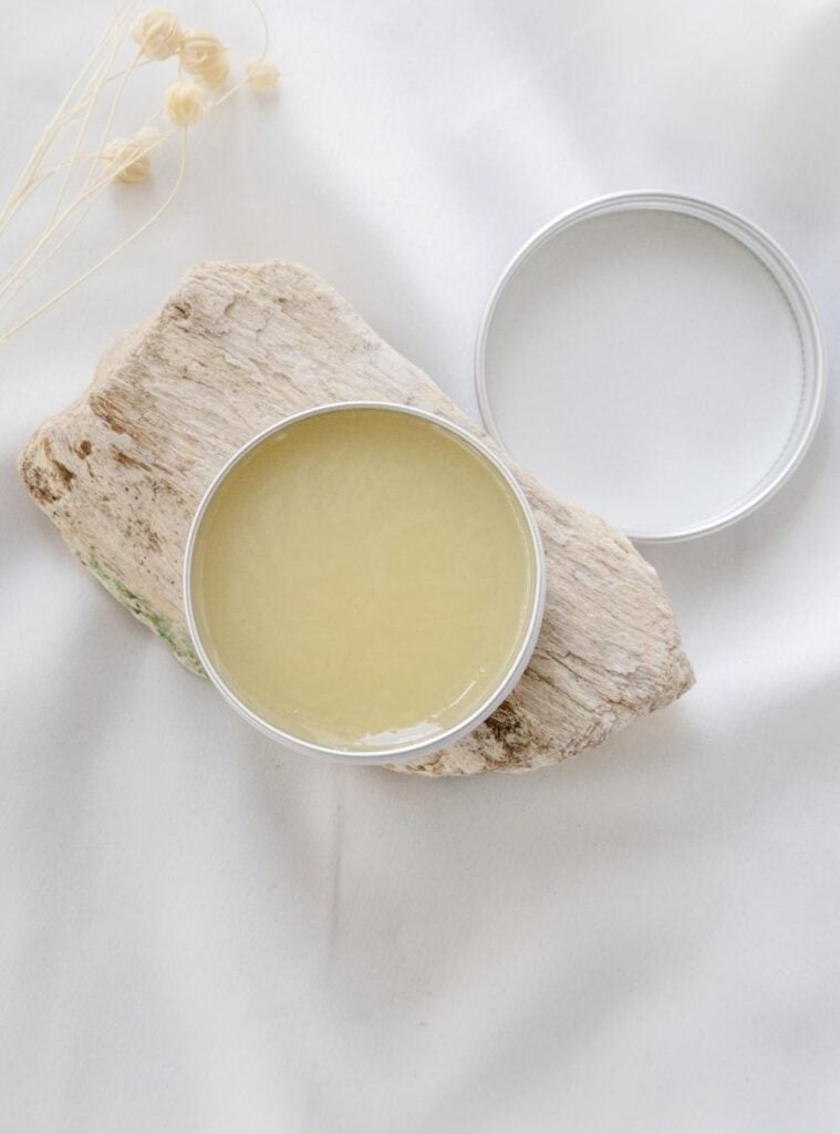 Zero-waste DIY lip balm in metal tins with essential oils and shea butter, ready to gift for the holidays.