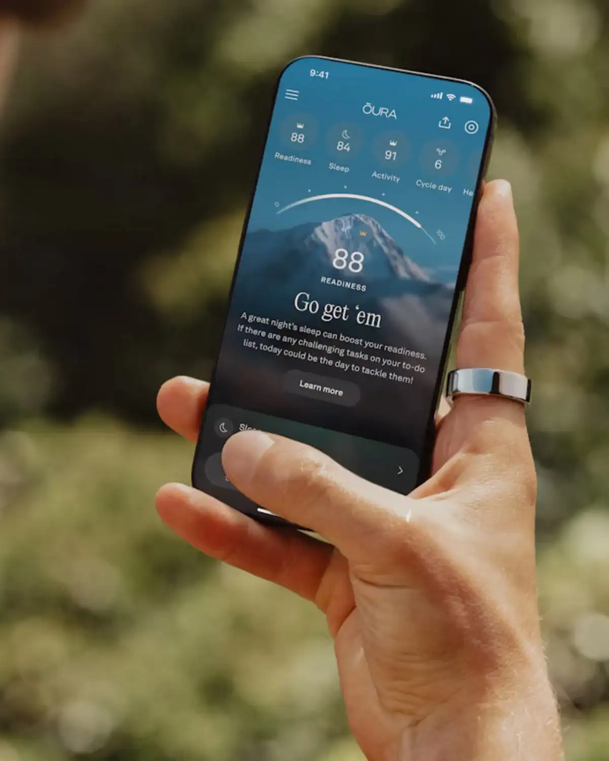 Oura Ring titanium health tracker monitoring sleep, readiness, and recovery, a high-tech wellness tool for data-driven dads.