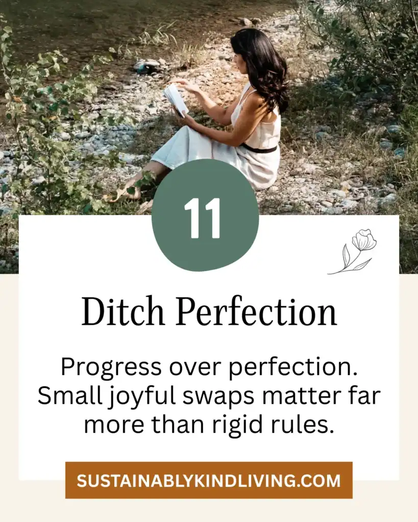 Ditch Perfection: Woman sitting by a river reading a book surrounded by nature.