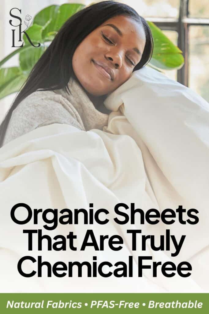 Woman smiling while wrapped in white bedding with text reading: “Organic Sheets That Are Truly Chemical Free – Natural Fabrics • PFAS-Free • Breathable.”