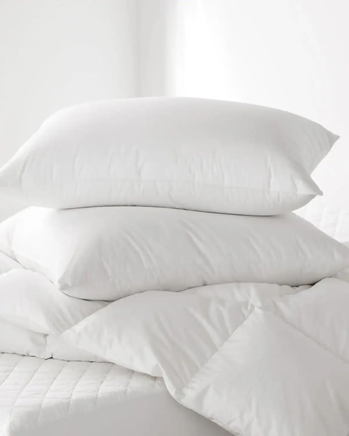 Coyuchi responsibly sourced down pillow with GOTS certified organic cotton cover.