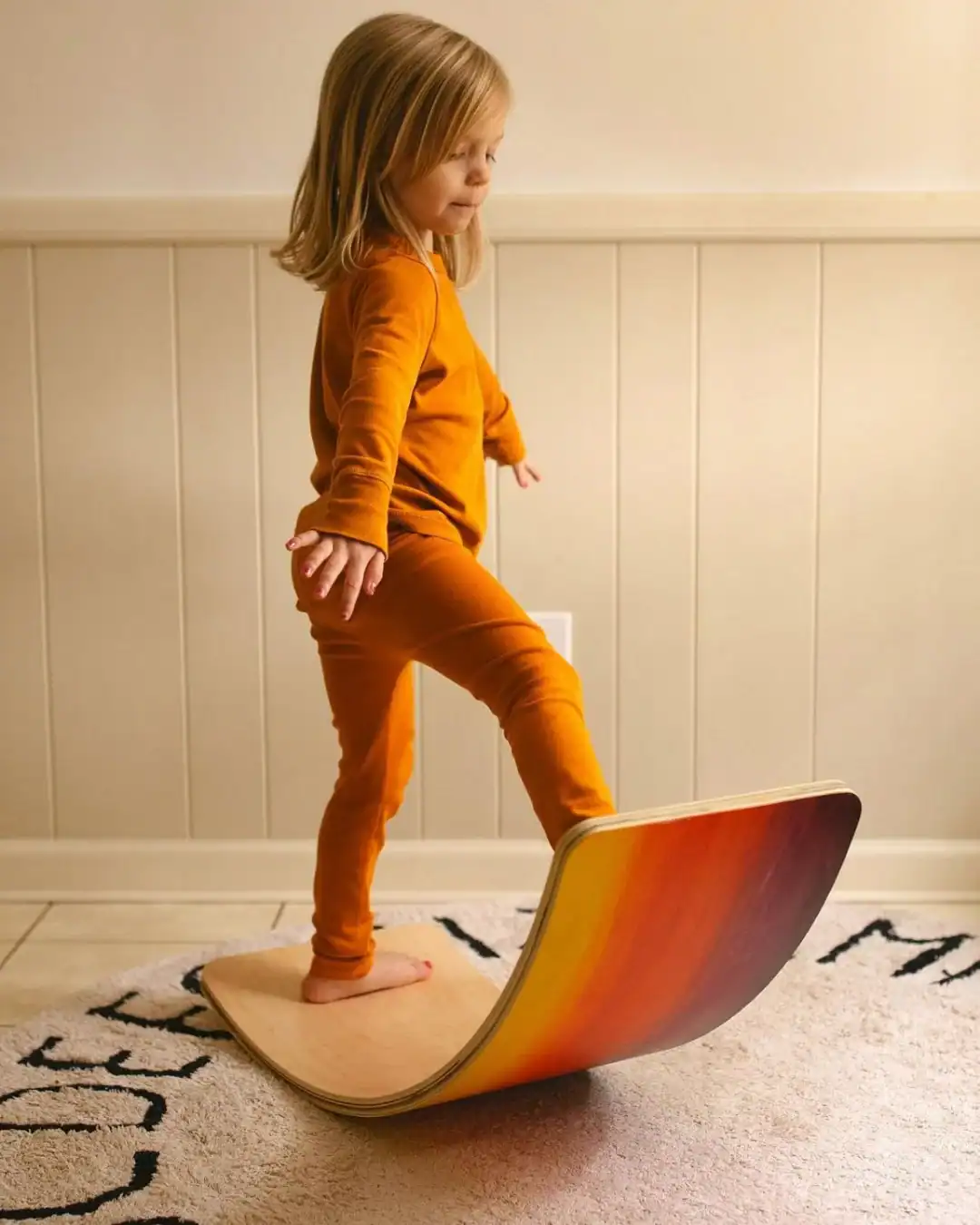 Wooden balance board for kids made from FSC-certified wood.