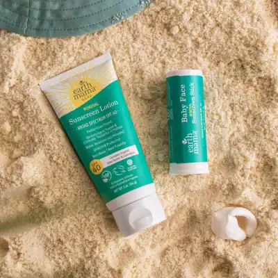 Earth Mama baby mineral sunscreen set featuring SPF 40 mineral sunscreen lotion and baby face sunscreen stick.