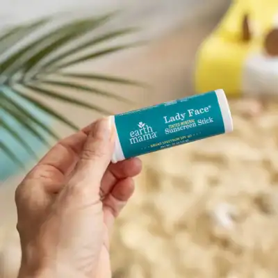 Earth Mama tinted mineral sunscreen face stick SPF 40 with non-nano zinc oxide and a sheer tinted finish.