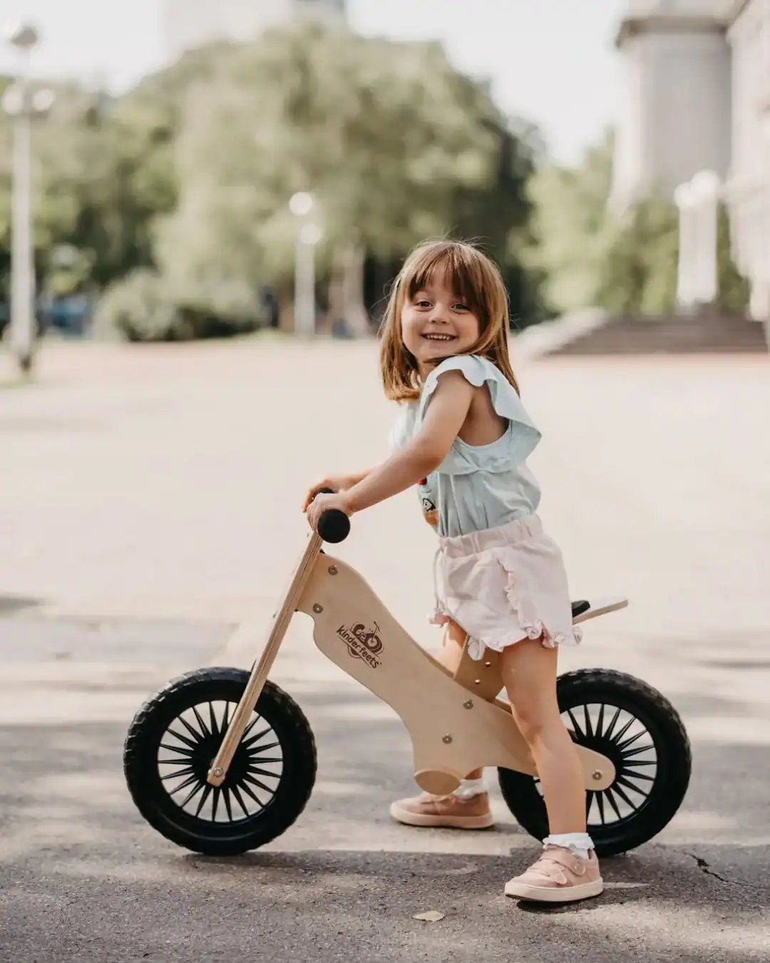Eco-friendly wooden balance bike for toddlers with non-toxic paint.