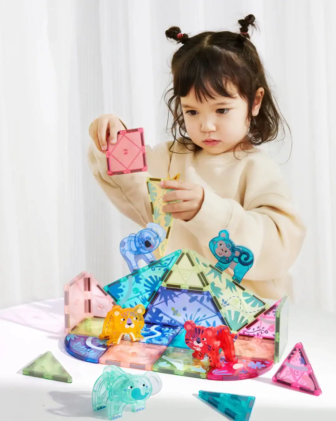 Non-toxic magnetic tiles for kids' STEM building play.