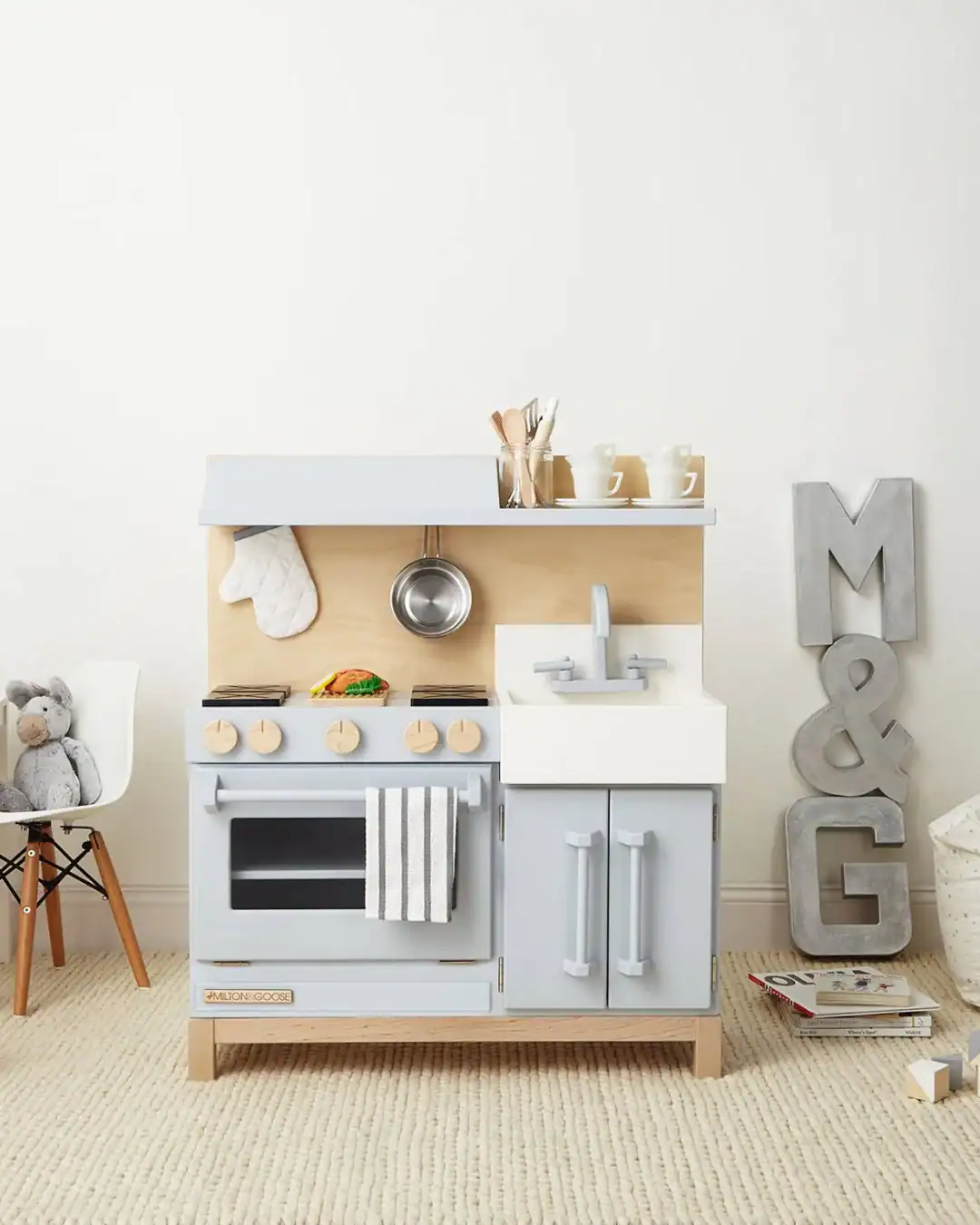 Non-toxic wooden play kitchen for kids made from solid wood.
