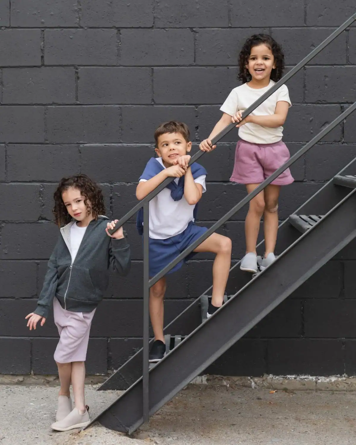 Child wearing Mini Mioche minimalist organic cotton kids clothing basics.