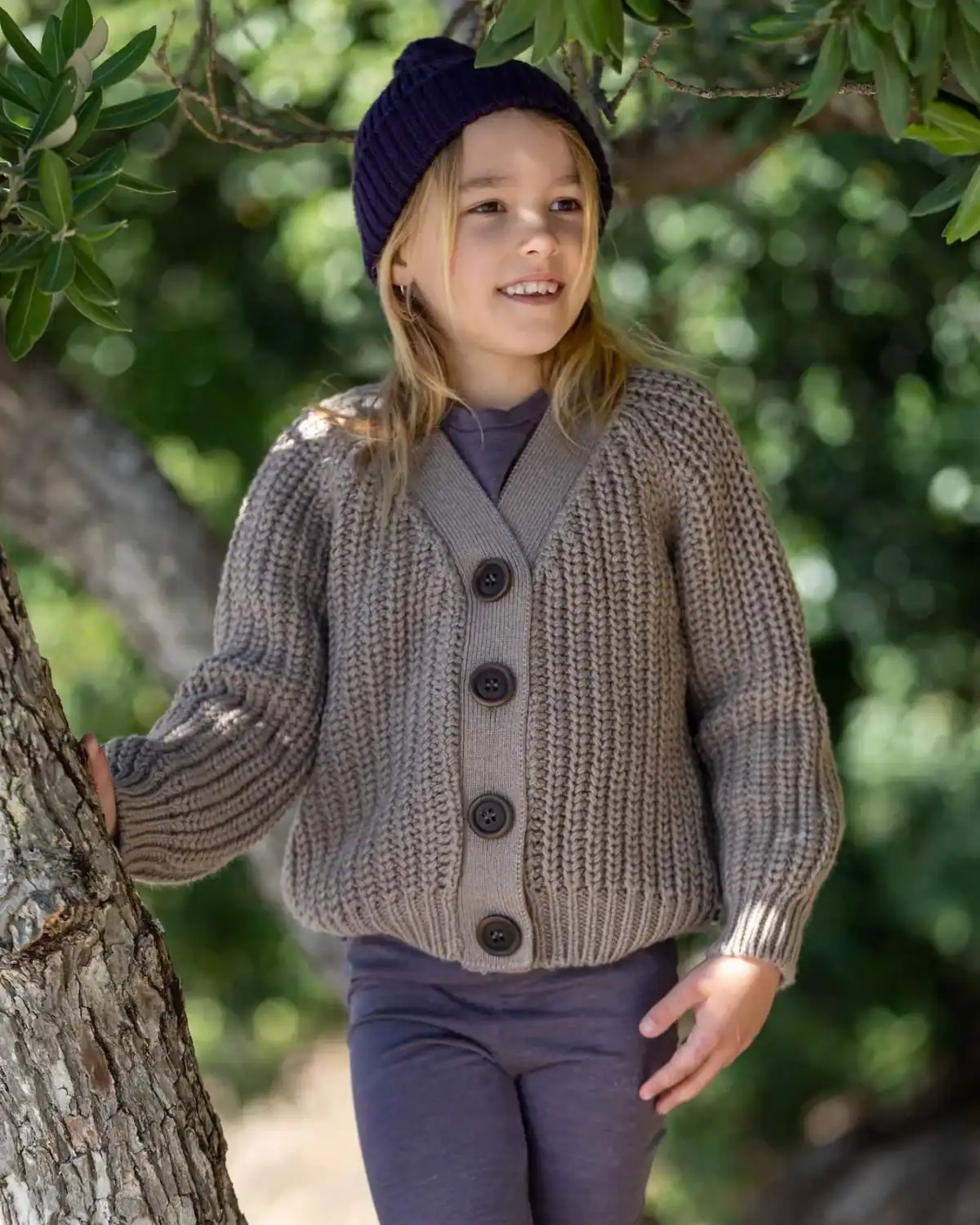 Child wearing Nui Organics merino wool kids clothing made from natural fibers.