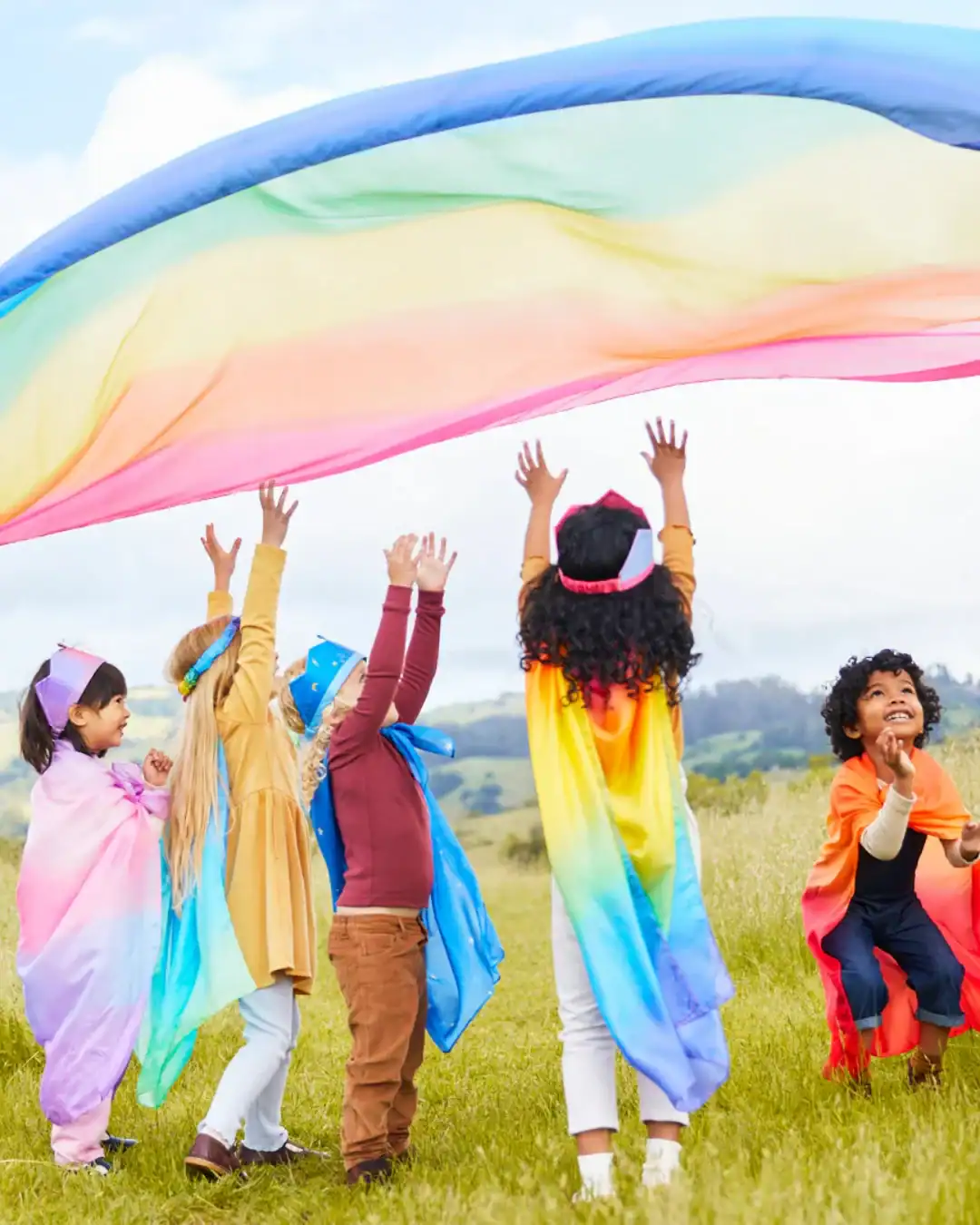 Silk play scarves for kids made with non-toxic dyes for imaginative play.