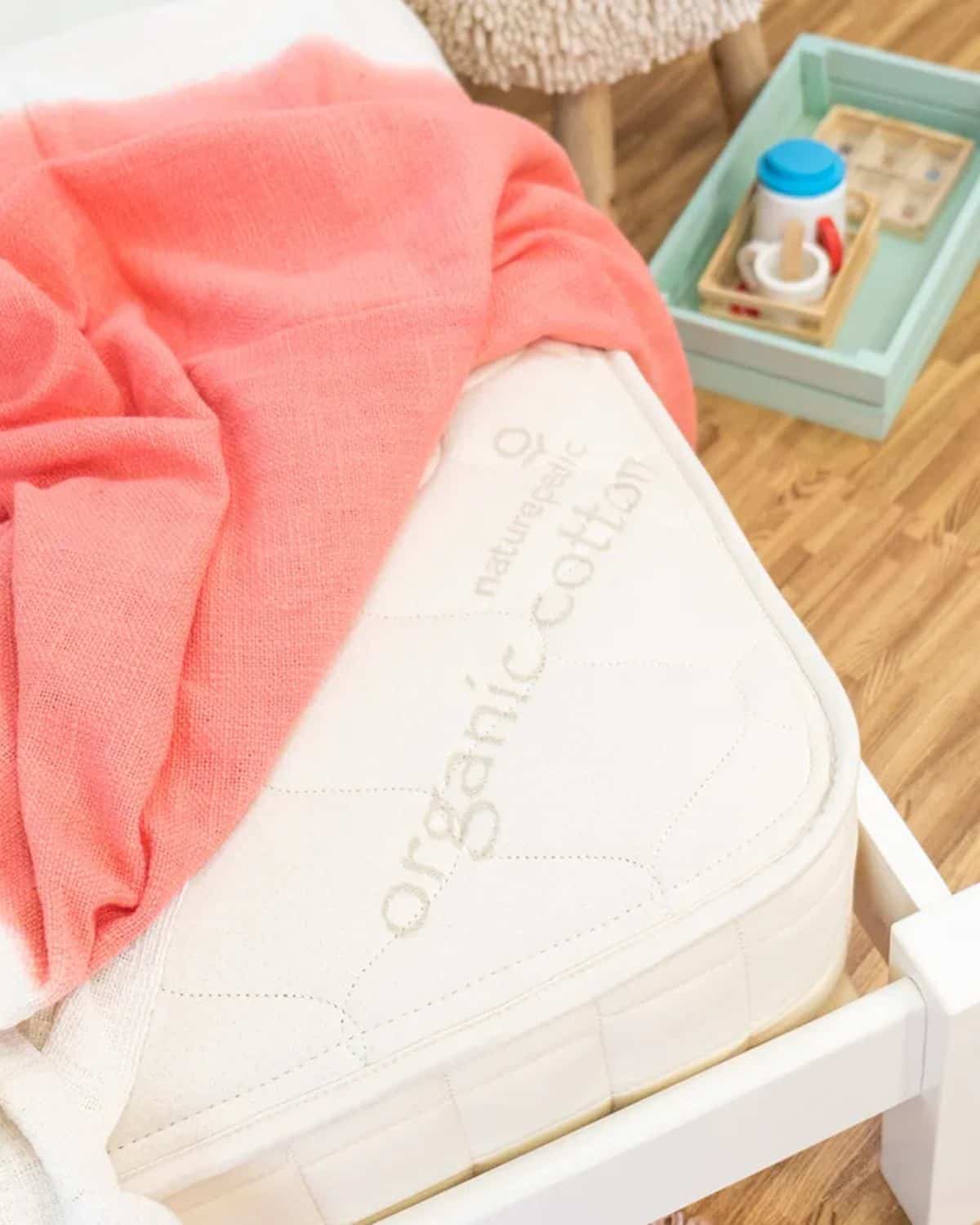 Naturepedic 2-in-1 organic kids mattress with waterproof side made from organic cotton and steel coils