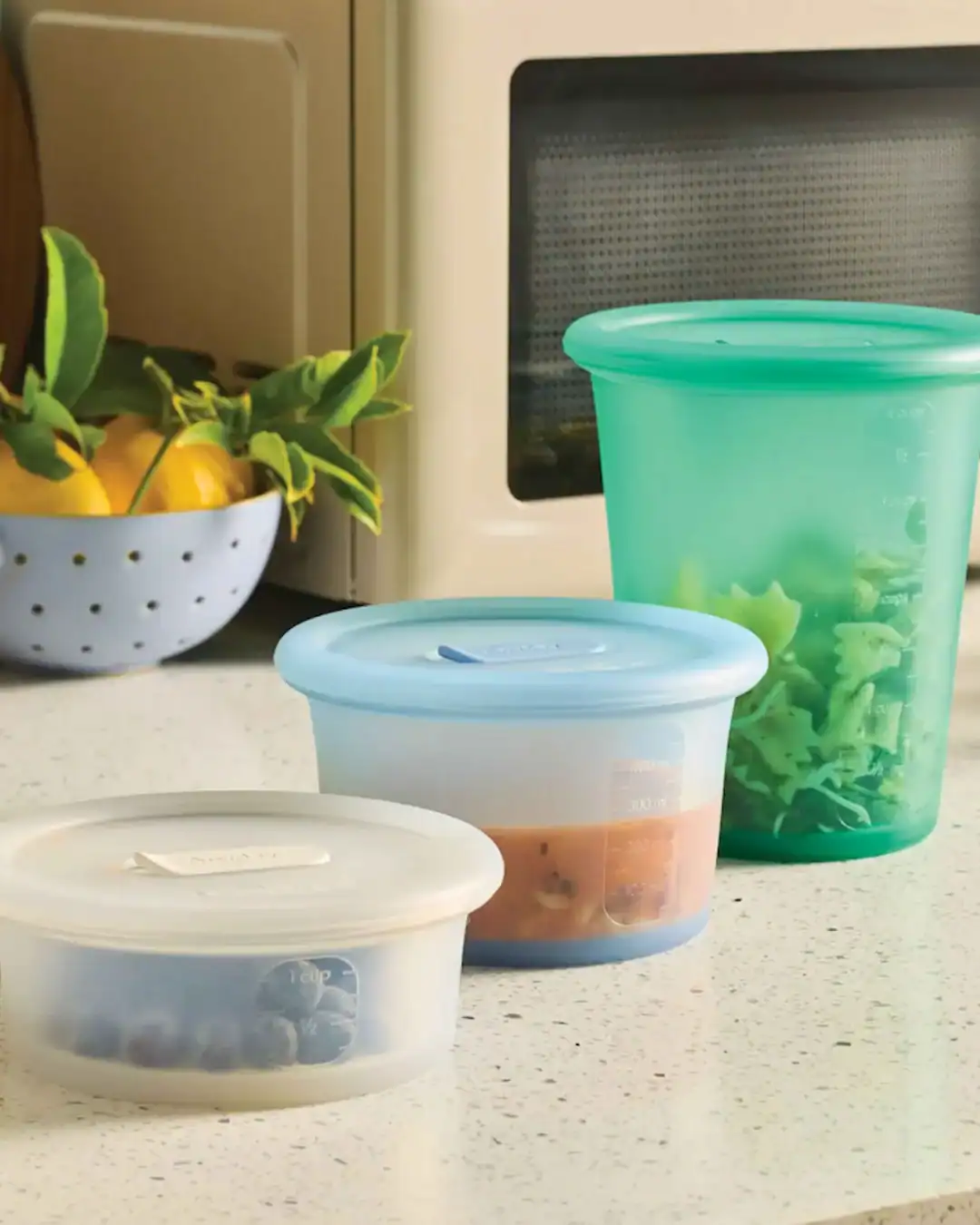 Silicone microwave containers with vented lids for reheating food without plastic.