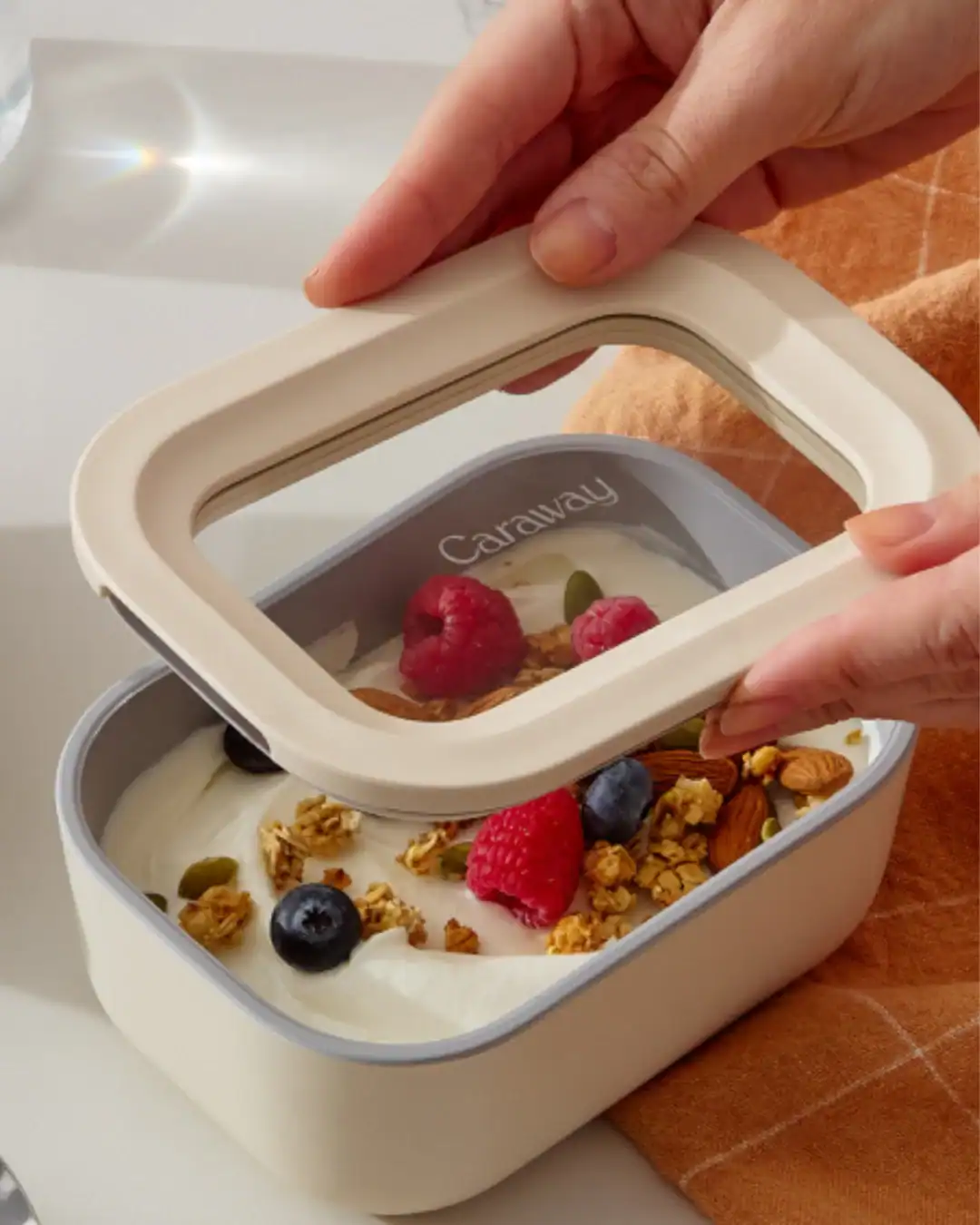 Ceramic-coated glass food storage containers used for microwave reheating.
