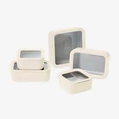 Caraway 13-piece Food Storage Set with ceramic-coated glass containers and airtight lids, a non-toxic alternative to plastic for safe food storage and reheating.