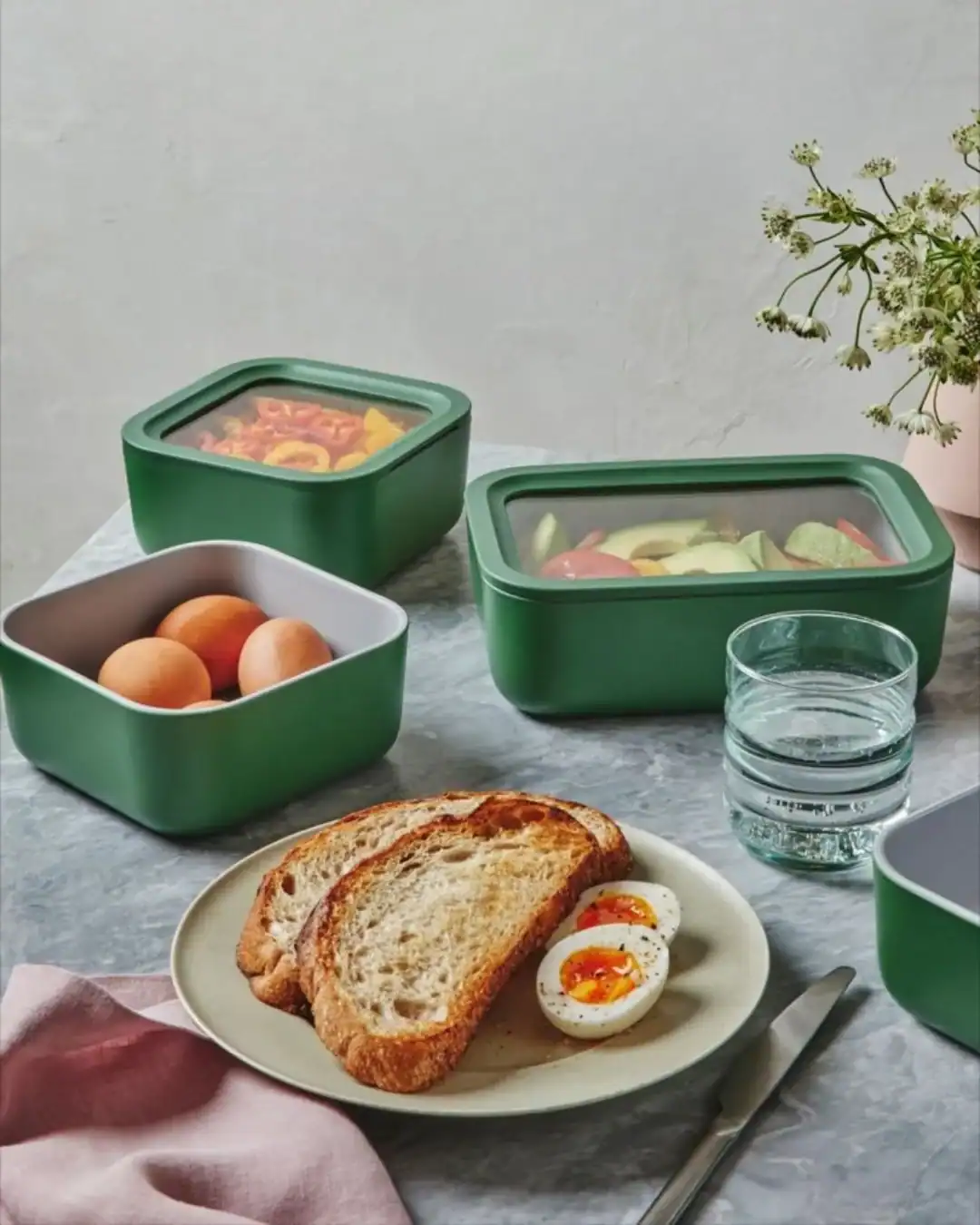 Caraway ceramic-coated glass non-toxic food storage containers with lids.