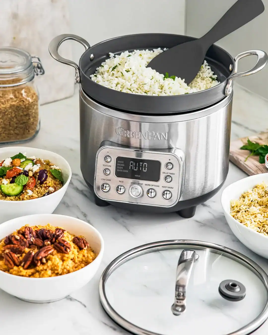 GreenPan rice cooker with stainless steel pot and carb-reducing basket system.