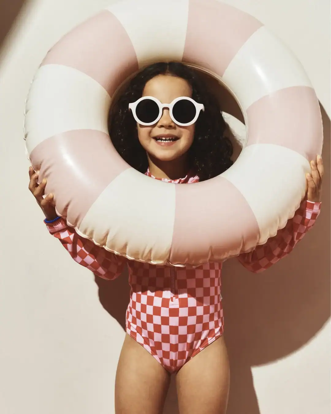Quince kids swimsuits made with recycled materials offering affordable non-toxic swimwear options.