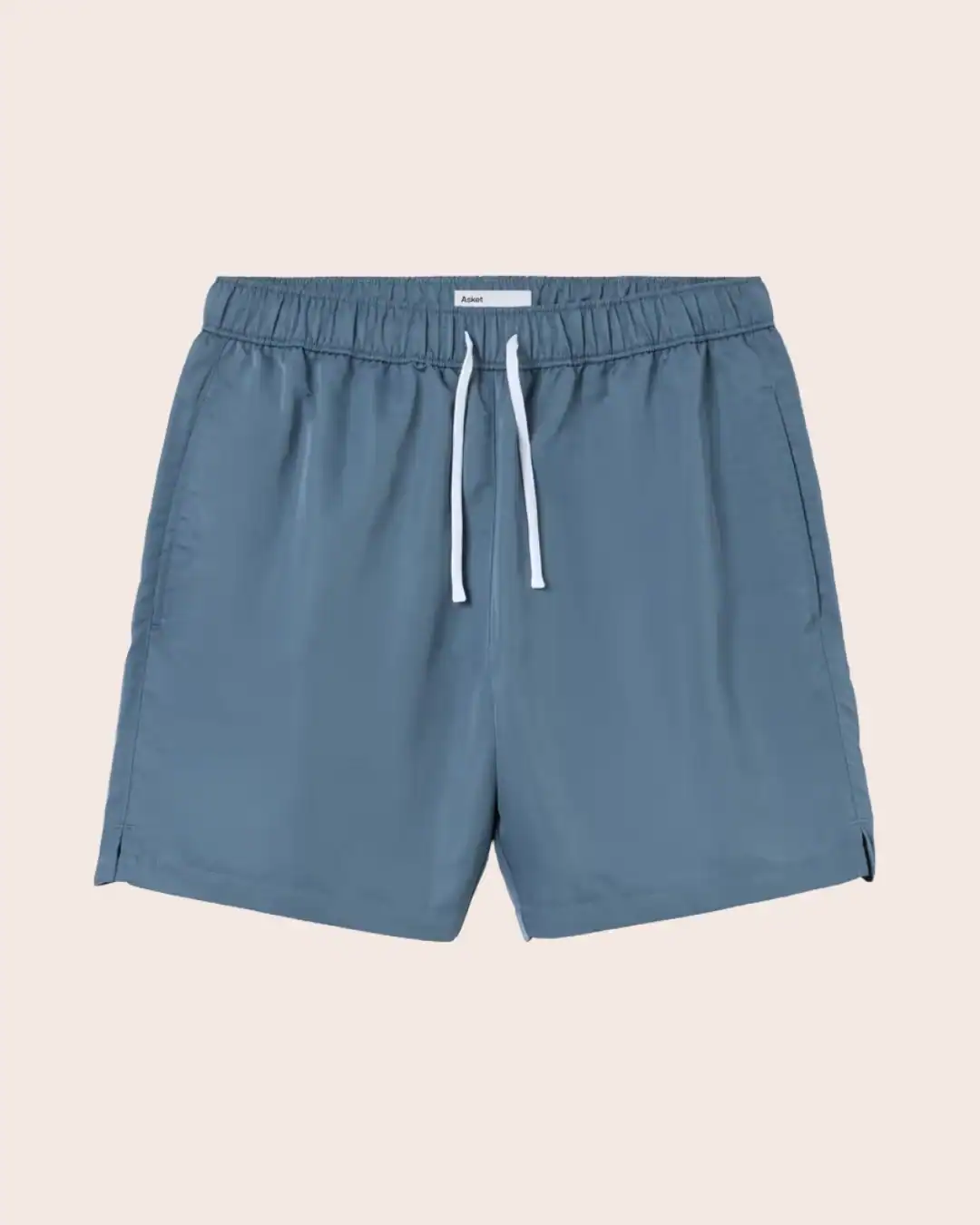 ASKET sustainable men’s swimwear made with recycled materials and transparent sourcing practices.