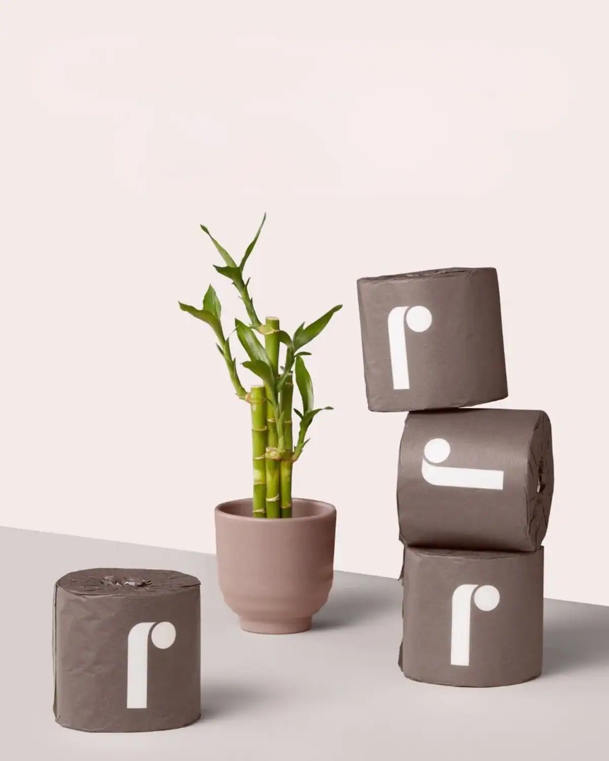 Reel bamboo toilet paper rolls displayed in a minimalist bathroom setting emphasizing softness and premium texture.