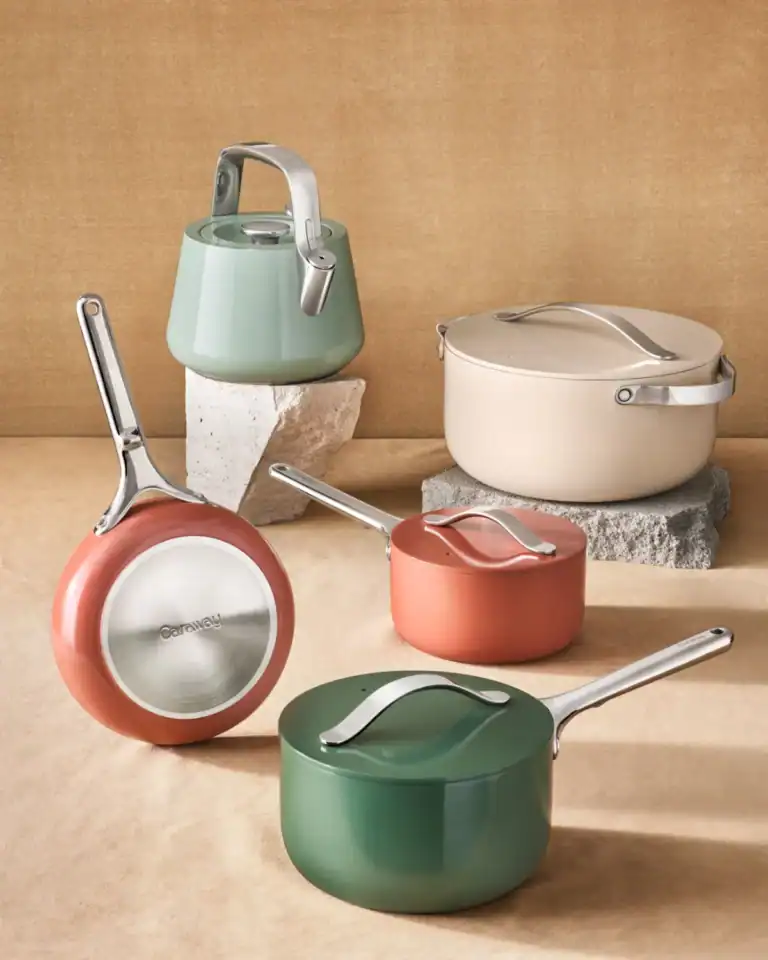Caraway ceramic cookware set with PFAS-free ceramic coating and storage organizers.