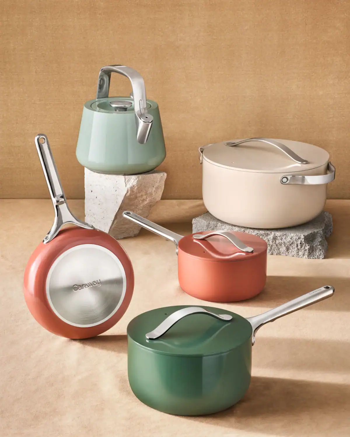 Caraway ceramic cookware set with PFAS-free ceramic coating and storage organizers.