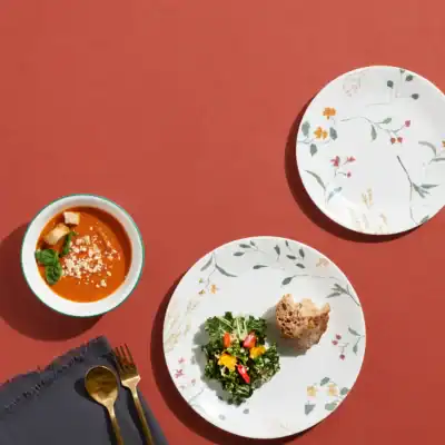 Corelle Vitrelle Wildflower glass dinnerware set with floral design and durable non-toxic glass construction.
