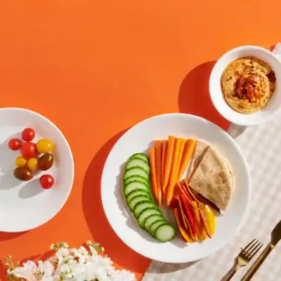 Corelle Vitrelle Winter Frost White glass dinnerware set made from durable chip-resistant tempered glass.