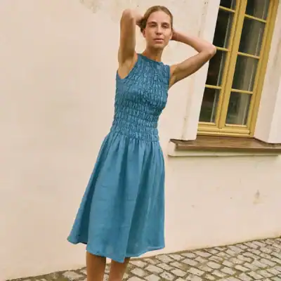 LinenFox Emilija linen midi dress in stellar blue featuring a smocked bodice, sleeveless design, and flowy skirt made from European linen.