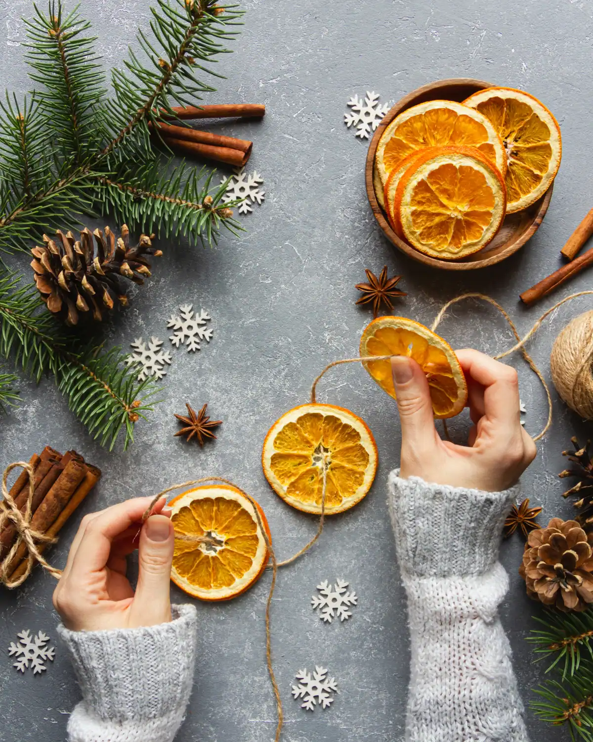 Dried orange slices and cinnamon sticks strung on twine as a holiday garland.