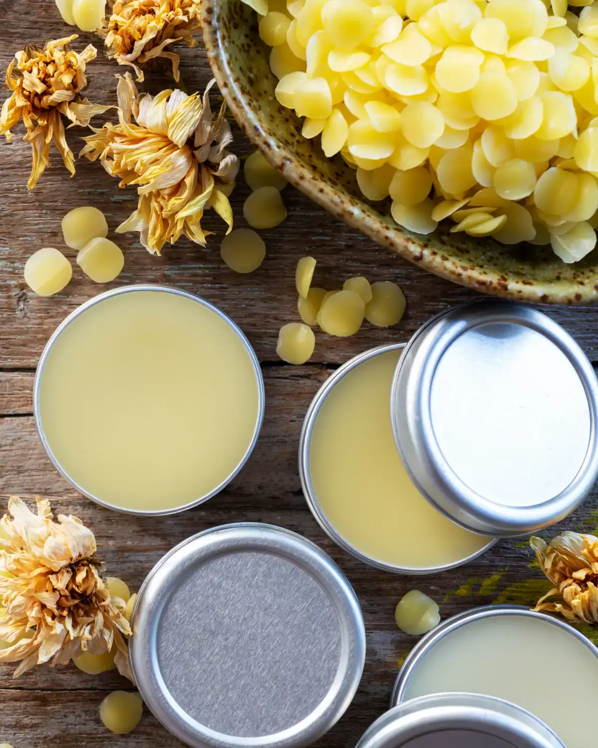 Homemade lip balm poured into small zero-waste tins.