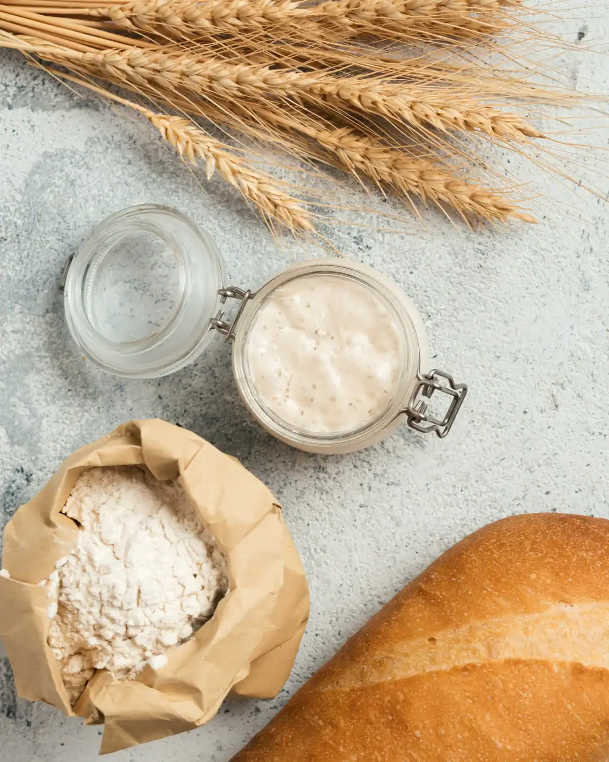 Active sourdough starter in a labeled mason jar.