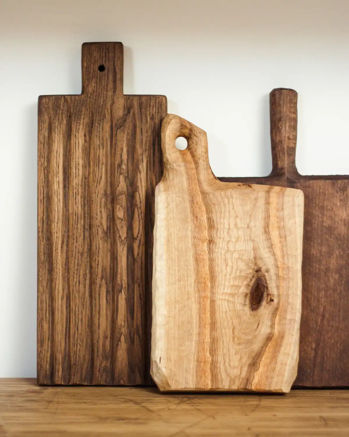 Wood-burned cutting board personalized with grandparent names.