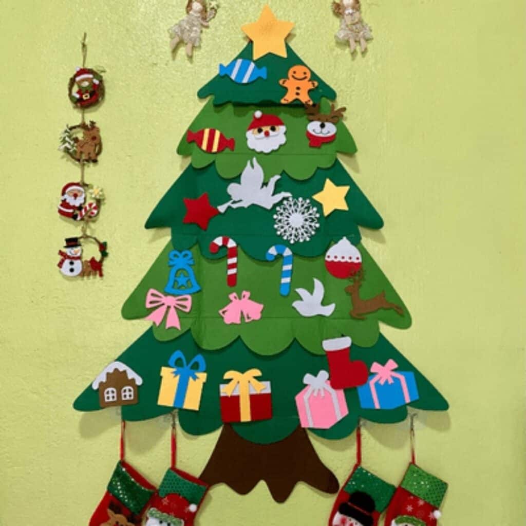 Reusable felt Christmas tree with removable ornaments designed as a fun holiday decoration for young children.