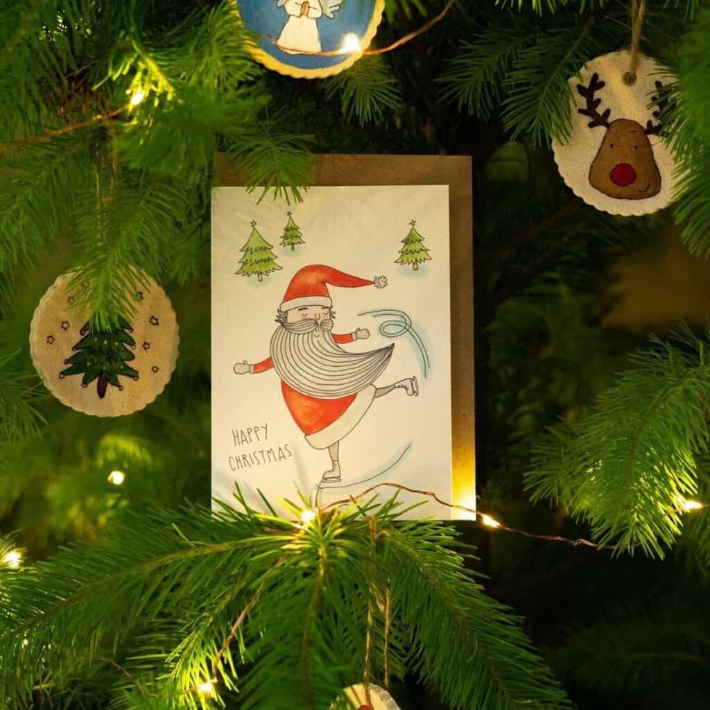 Decomposition recycled Christmas cards made with post-consumer recycled paper and artistic holiday designs.