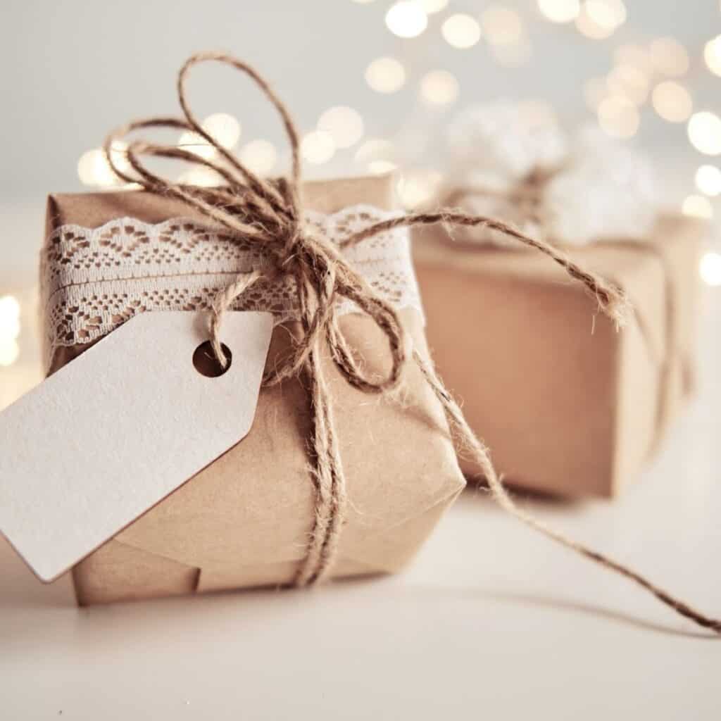 Minimal Christmas gift wrapped with kraft paper, natural twine, and a blank gift tag for non-toxic Christmas wrapping.