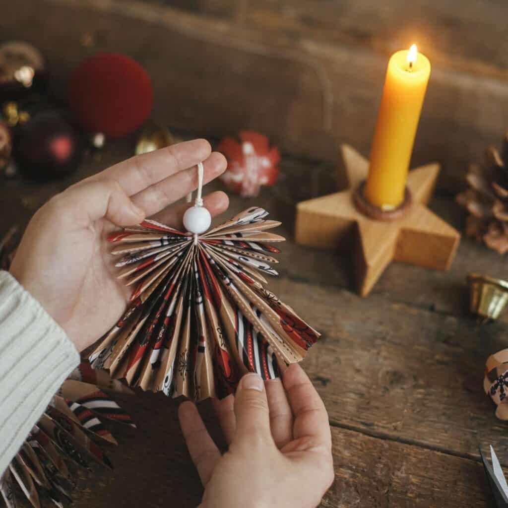 DIY paper Christmas ornament for non-toxic Christmas decor made from folded recycled paper.
