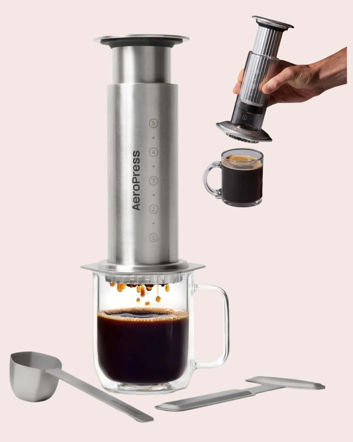 AeroPress Steel stainless steel coffee press shown over a glass mug, with a second view held above a smaller cup