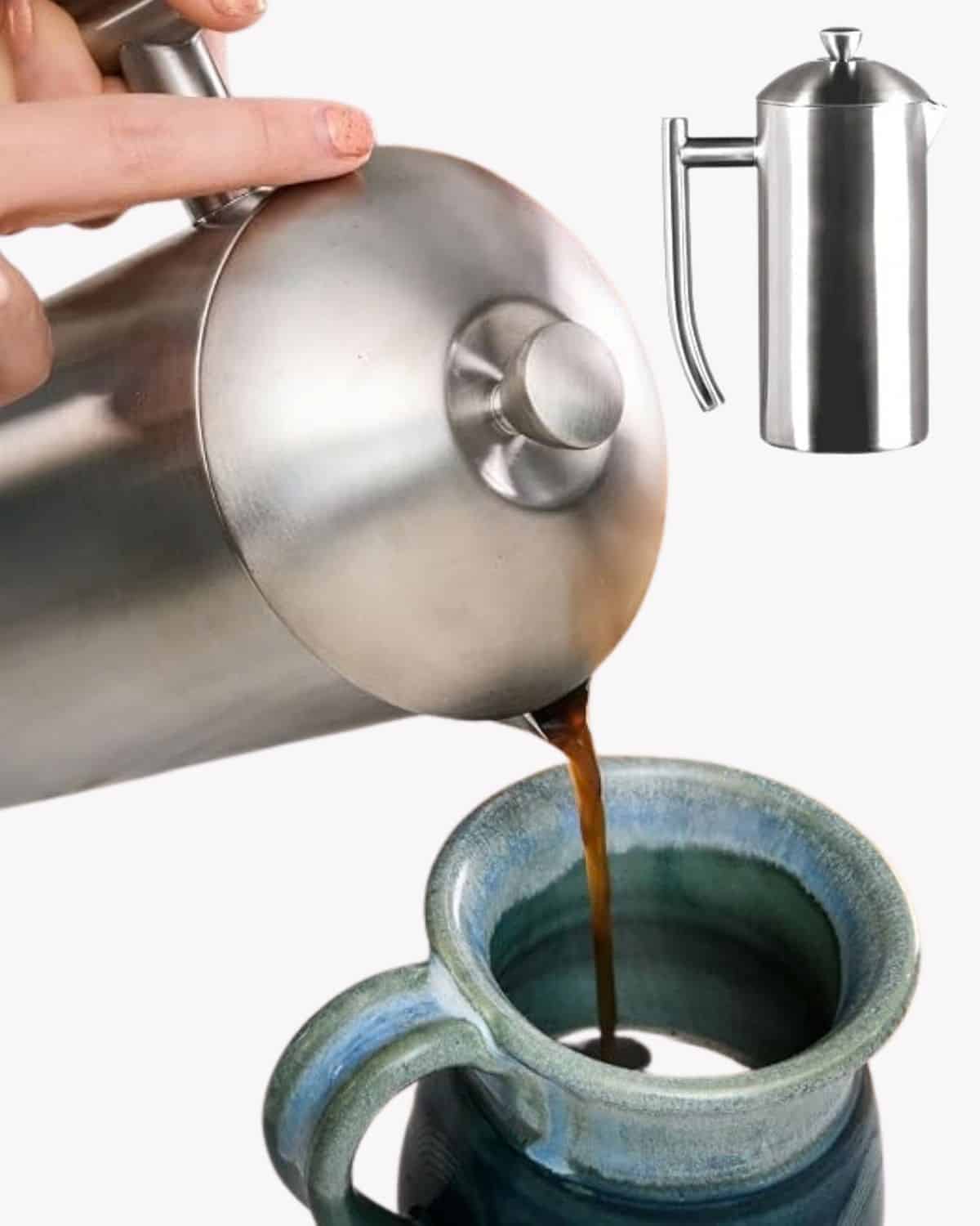Coffee pouring from a stainless steel Frieling French press into a blue ceramic mug