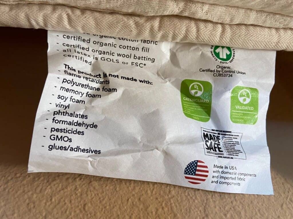Happsy organic mattress label listing materials and displaying GOTS, GREENGUARD Gold, and MADE SAFE certification marks.