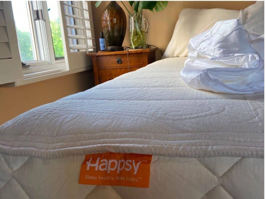 Happsy Plush King mattress without the separate topper, showing its quilted surface and orange Happsy logo.